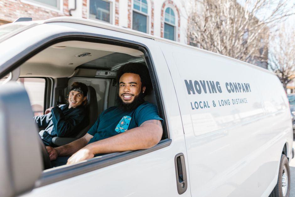 Friendly professional movers planning a route