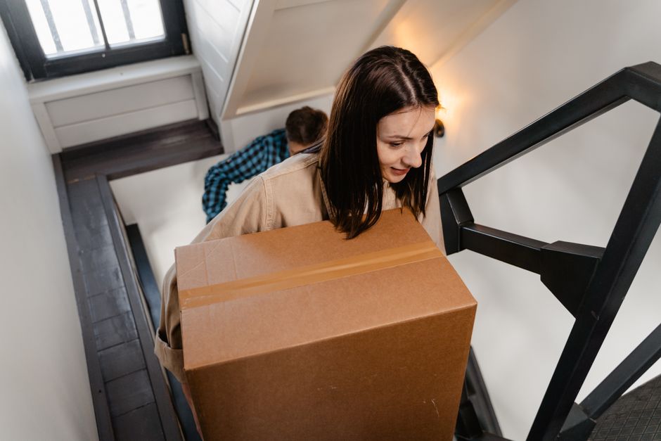 Family moving into a new house with boxes